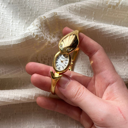 relógio serpente dourado