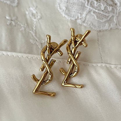 brincos Yves Saint Laurent
