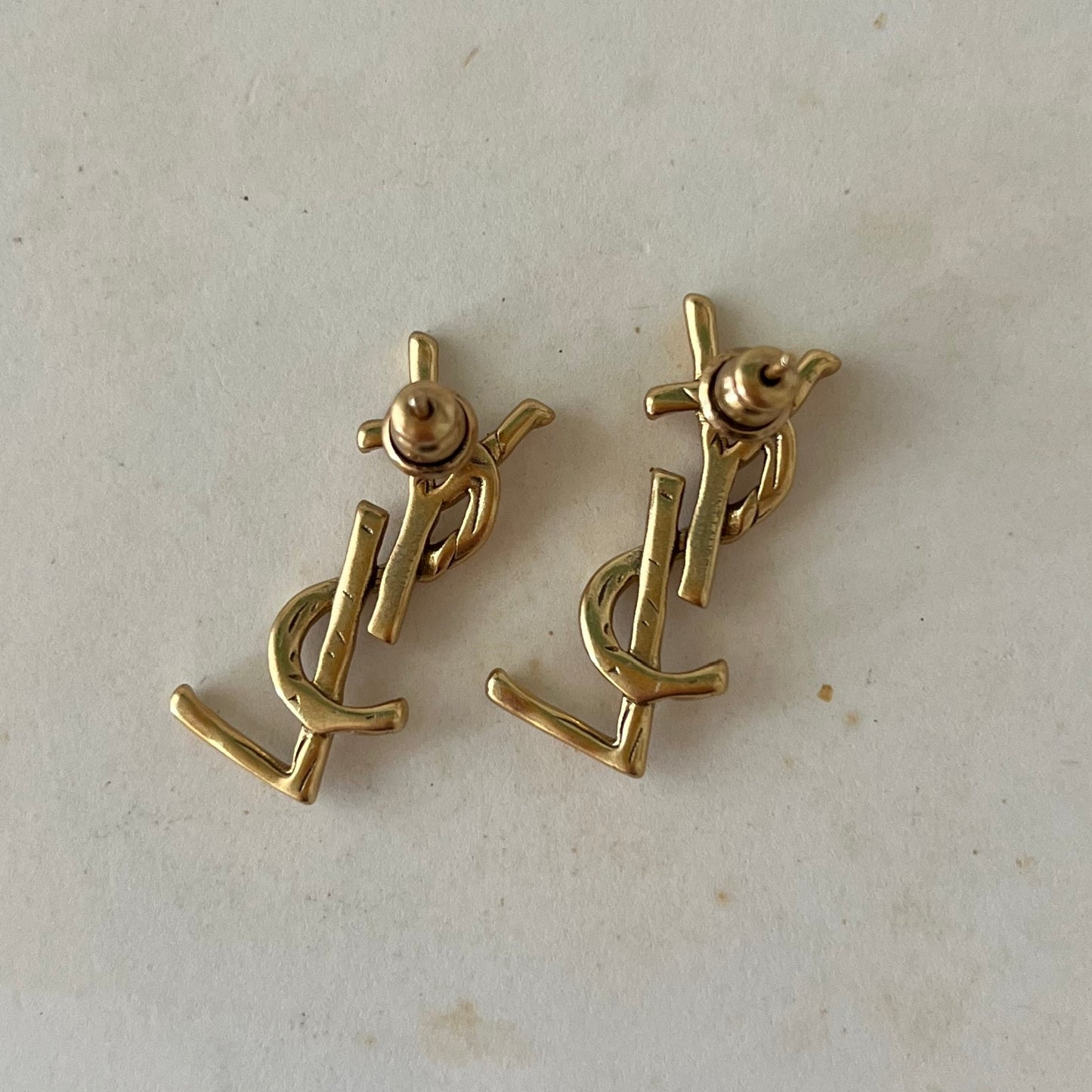 brincos Yves Saint Laurent