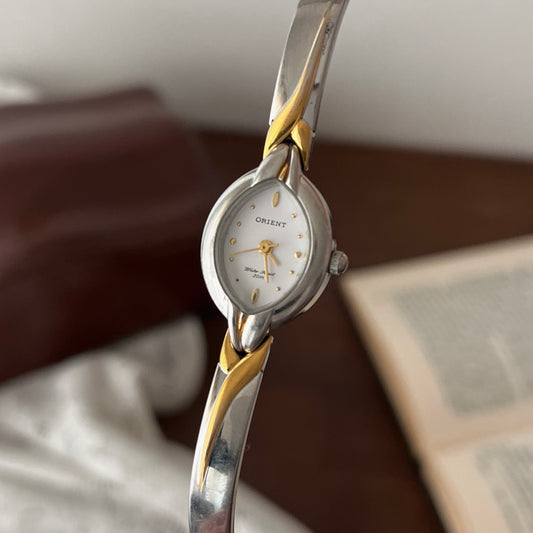 relógio orient dual tone