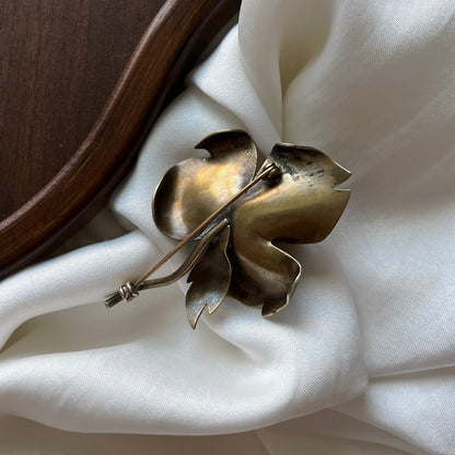 broche rosa de bronze